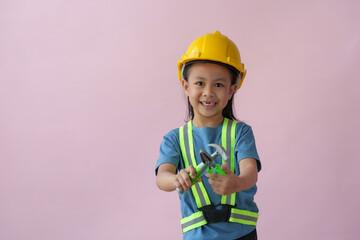 Little handyman with tools Cute child is a construction worker playing with a screwdriver, hammer,...
