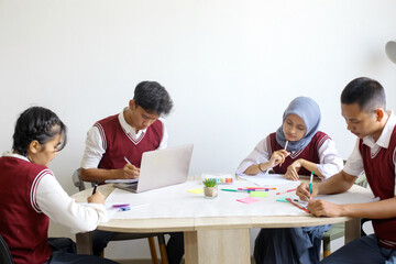 High School Students Doing School Work Together at The Study Room
