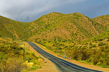 Landscape of green hills and overcast sky on Route 62 in the Little Karoo near Calitzdorp in the Western Cape, South Africa