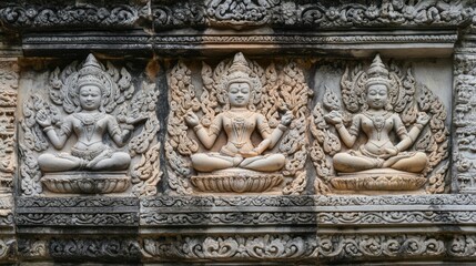 The intricate stone reliefs at Phimai Sanctuary, depicting scenes from Hindu mythology.