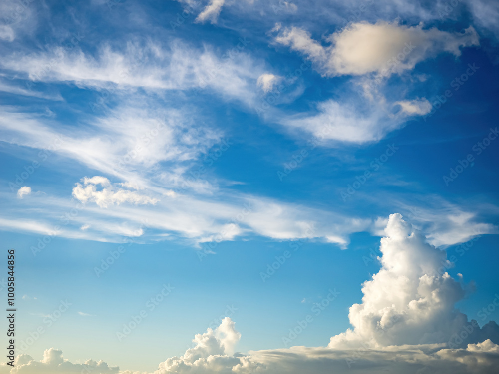 Wall mural blue sky with clouds and sun, the sunset behind the clouds