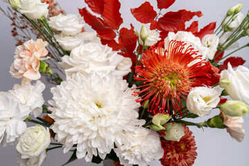 Beautiful bouquet and different flowers on a light background. Flower petals. Floral wallpaper. Pattern of fresh flowers. Floral design of a postcard with a light vintage effect