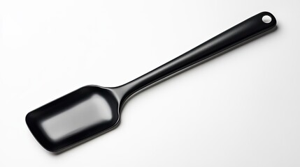 Fototapeta premium A sleek black scoop with a long handle, ideal for serving and measuring ingredients in kitchens or food preparation.