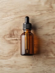 Naklejka premium A glass bottle with a dropper, likely containing a liquid such as essential oil or serum, arranged on a light wooden surface