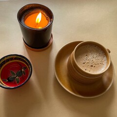 cup of coffee with candle