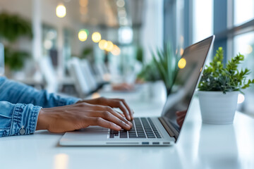 Close-up of hands typing on computer keyword