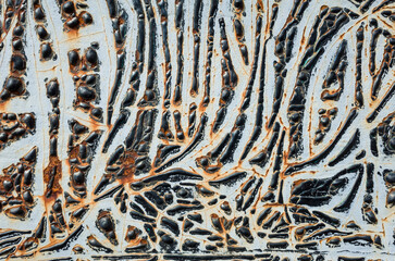 Rough vintage texture black nd white background, Intricate pattern of peeling and swollen paint exposing rust on old metal surface creating abstract art