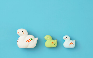 Japanese new year material. Zodiac Snake. Snake ornament on the light blue background. 日本のお正月素材。干支の巳（ヘビ）。水色背景上の巳の置物