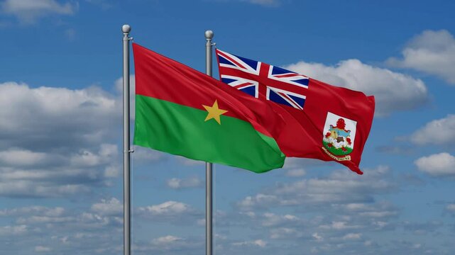 The Bermudas and Burkina Faso flags flying together, video concept of the relationship, two country relations concept