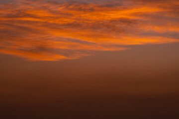 Enjoy a panoramic view of the skyline. The sun rises in the morning sky with colorful clouds. and beautiful cloud patterns In the soft light of the morning	
