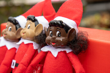 A biracial naughty Elf doll or Elves Behaving Badly Boy and Girl ELF- Naughty Elves