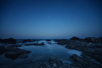 Amazing view with starry night sky during the Perseids flow at the rocky Black Sea coast, Bulgaria