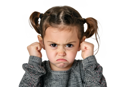 An angry little girl with clenched fists and furrowed brows, expressing her emotions.
