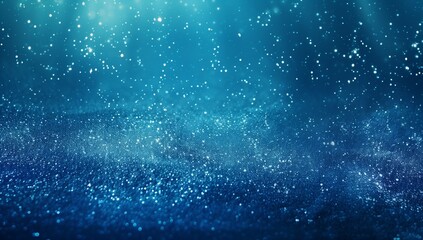 Abstract dark blue glitter background with bokeh lights and space for text or design.