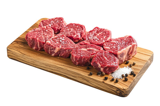 marbled beef steak cuts on a wooden board, with a sprinkle of sea salt and cracked pepper.