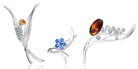 Three silver brooches with different gemstones in floral style on isolated background