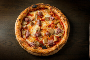 italian pizza gourmet with cep mushroom and sausage