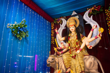 A beautiful idol of Maa Durga being worshipped at a pandal during Navratri. Navratri is biggest...