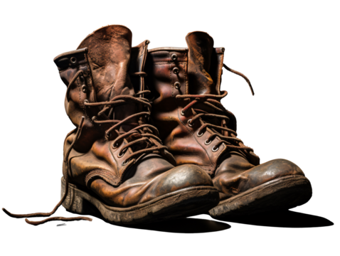 a pair of brown boots - Powered by Adobe