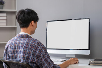 Young Boy Studying Online at Home Using Desktop Computer in Modern Study Room