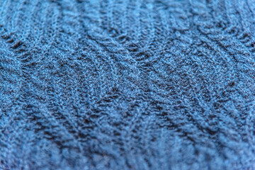 abstrakt background of blue handmade cashmere knitted texture close up shallow depth of field