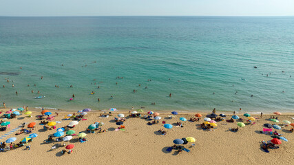 Aerial view of a person on vacation on a public beach in San Pietro in Bevagna in Salento, Puglia,...