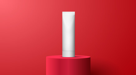 White blank cosmetic tube on red podium in red room background