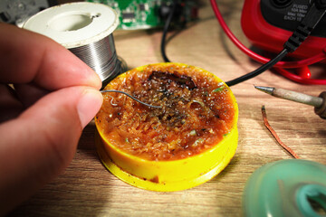 Close up of soldering paste or flux using by electrician for soldering lead , Electric appliance...