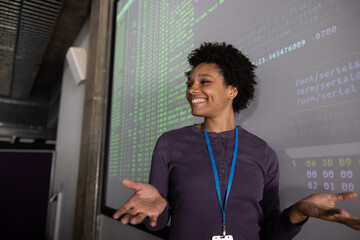African American female coder presenting at a tech conference