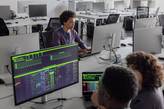 African American woman computer programmer working on software development