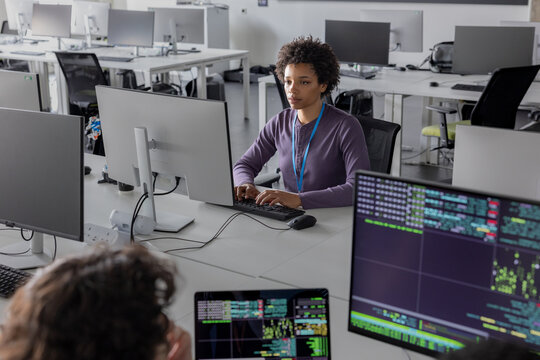 African American female coder working on computer software