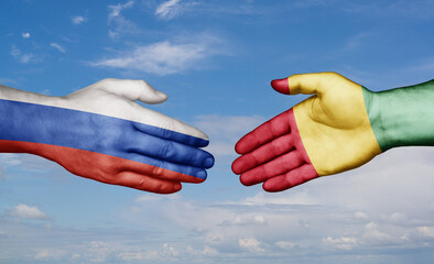 Republic of Guinea and Russia country handshaking with flags, consensus concept international co-operation illustration