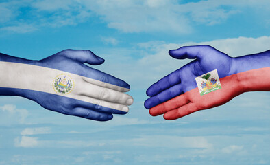 Haiti and Salvador country handshaking with flags, consensus concept international co-operation illustration