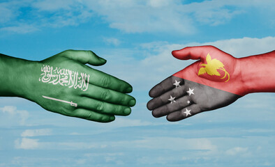 Papua New Guinea and Saudi Arabia country handshaking with flags, consensus concept international co-operation illustration
