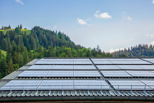 Solar panels on the roof of a house overlooking Lake Walen in Betlis, Switzerland - Powered by Adobe