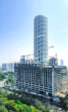 Dubai, United Arab Emirates &ndash; September 26, 2024: Construction boom in Dubai. Construction site in front of FIVE Jumeirah Village Hotel, JVC. Rapid urban development, big city expansion concept 
