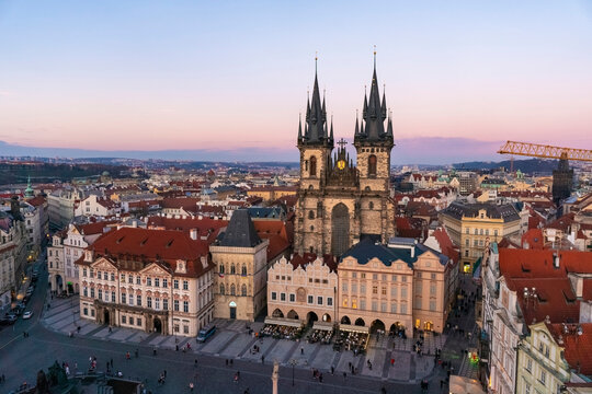 Aerial view of the panoramic view by sunset blue hour of the old town square with the National Gallery and The Church of Our Lady before Tyn in Prague, Czech Republic, nobody.