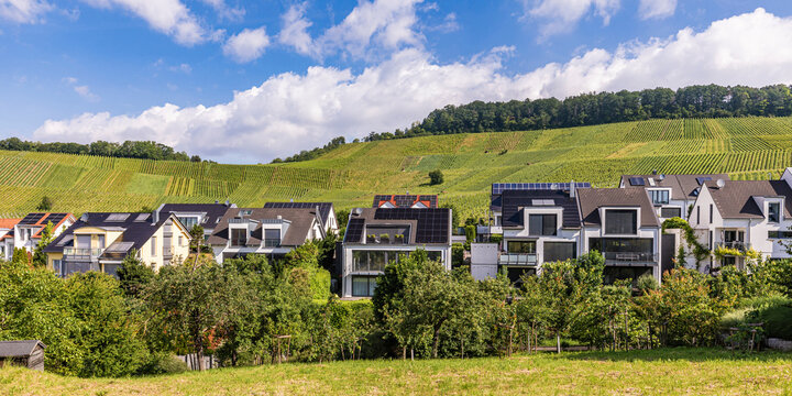 Modern single family homes with photovoltaic systems and a vineyard near Waiblingen, Baden-Wuerttemberg, Germany.