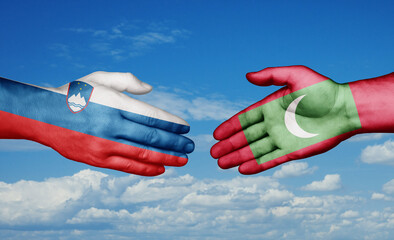 Maldives and Slovenia country handshaking with flags, consensus concept international co-operation illustration