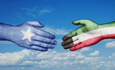 Kuwait and Somalia country handshaking with flags, consensus concept international co-operation illustration