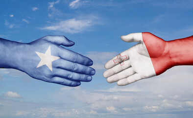 Malta and Somalia country handshaking with flags, consensus concept international co-operation illustration