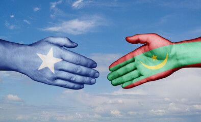 Mauritania and Somalia country handshaking with flags, consensus concept international co-operation illustration