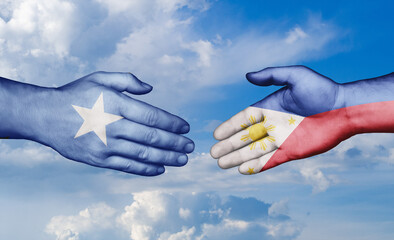 Philippines and Somalia country handshaking with flags, consensus concept international co-operation illustration