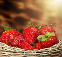 Fresh strawberries overflowing from a wicker basket