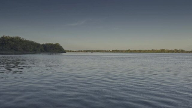 Filming of the Tejo  River in Portugal with sunset and trees.