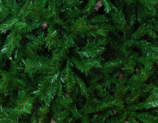 Artificial christmas tree showing lush green needles background