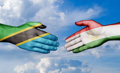 Tajikistan and Tanzania country handshaking with flags, consensus concept international co-operation illustration
