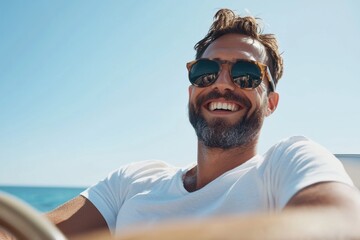 Handsome man smiling wearing sunglasses driving boat on ocean vacation