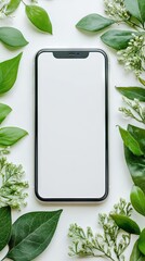 Smartphone with blank screen on white background. Flat lay, top view