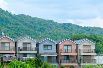 Pastel-colored Japanese prefabricated houses in summer